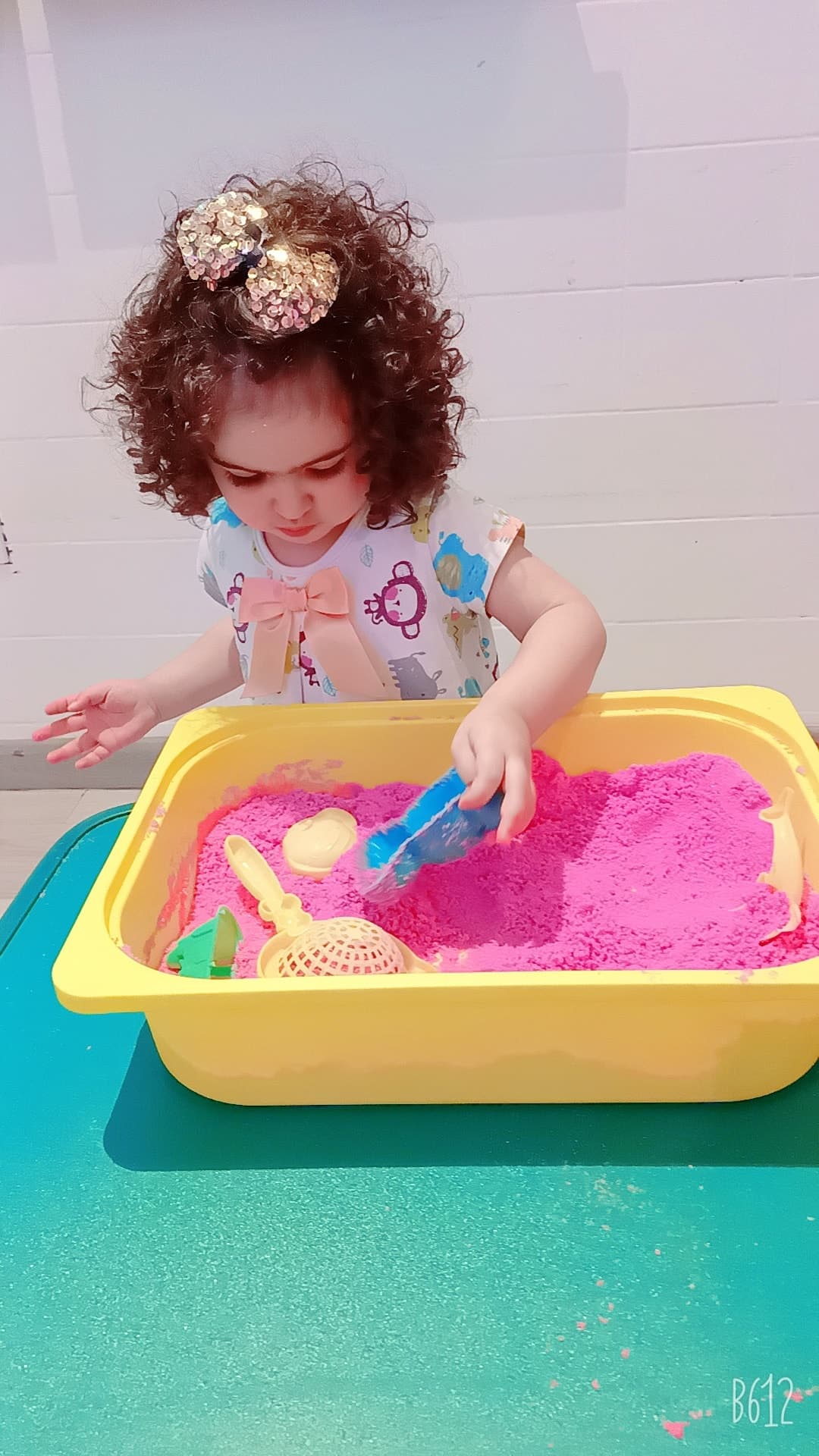 Child exploring kinetic sand — sensory play